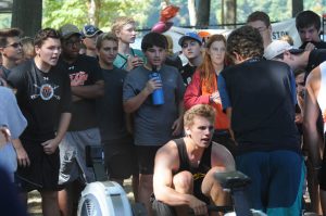 Teammates cheer on senior Kyle Brisky during the ergathon, which raised $30,000 for Wayland-Weston Rowing Association PHOTO / Bernie Scozzafava