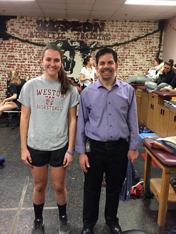 Weston Athletic Trainer Andrew Rizza stands alongside Junior Whitney Sins who recovered from a torn ACL and Meniscus and is back to playing varsity sports with the assistance of Rizza. 
