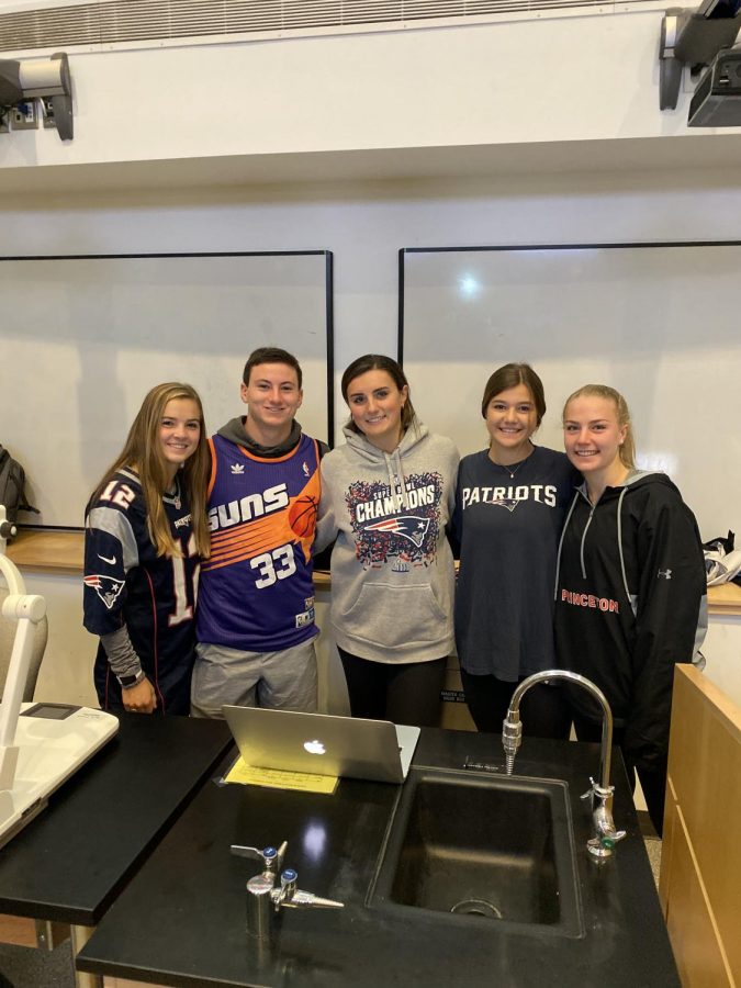 Seniors Lila Kosowsky, Jack Noonan, Julia Colangelo, Kay Cochran, and Luca Leschly pose for a photo after a Pumpkin Fest committee meeting. 