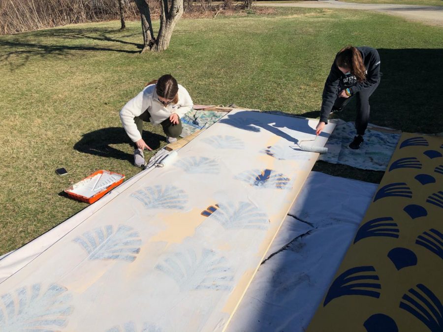 Juniors Elizabeth Crawford and Natalie Ladocsi work on play prop.