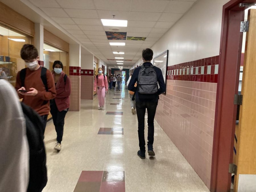 Students transition from class to class wearing masks safely