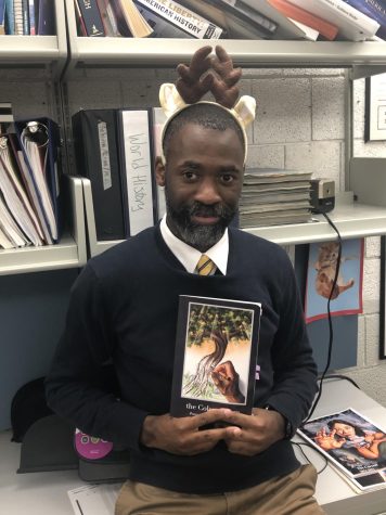 Dr. Henry with his new poetry book 