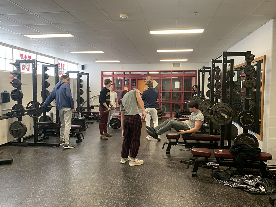 Students lifting weights after school