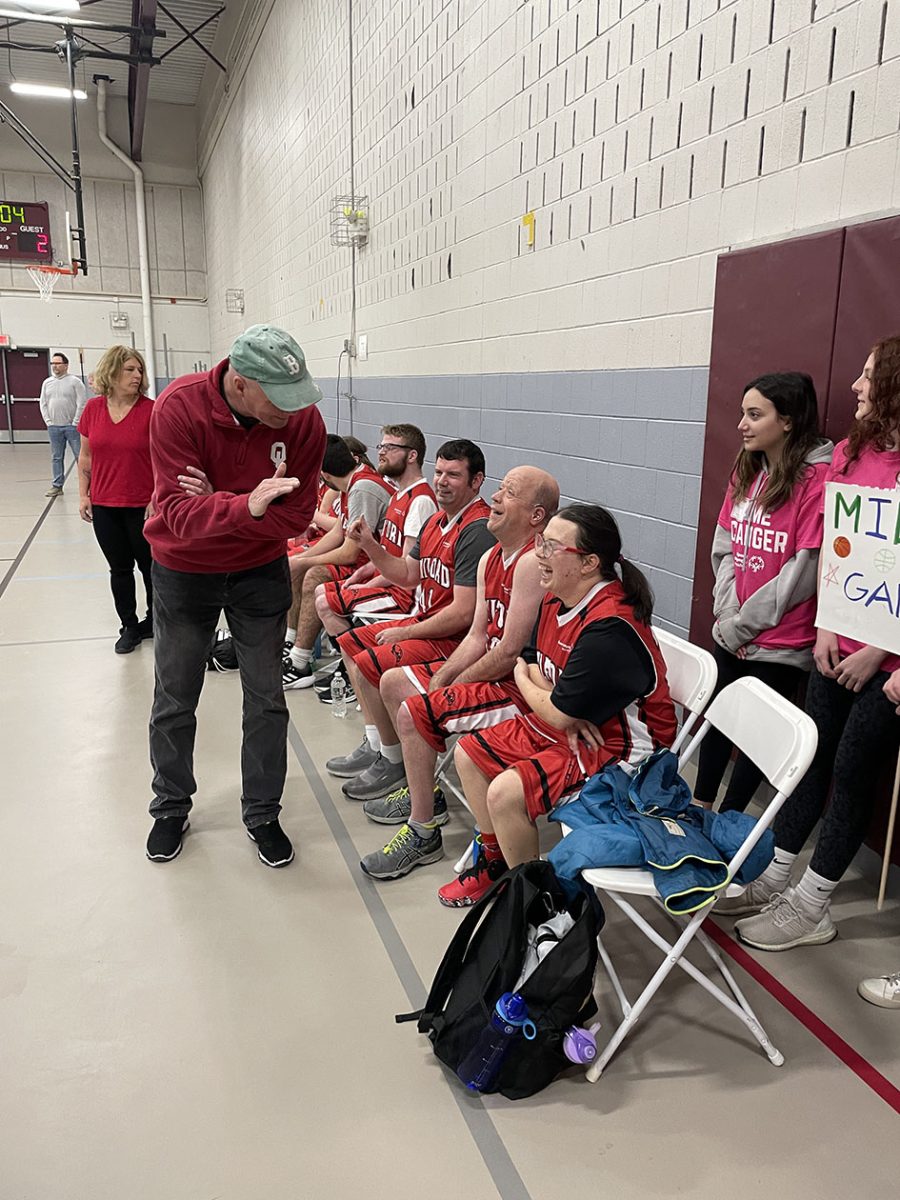 Special Olympics athletes are coached during a game