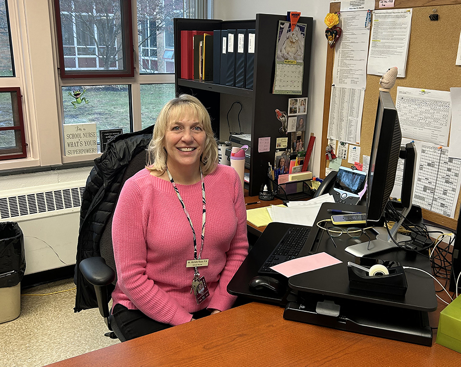 Nurse Michelle Rizza in her office helping students