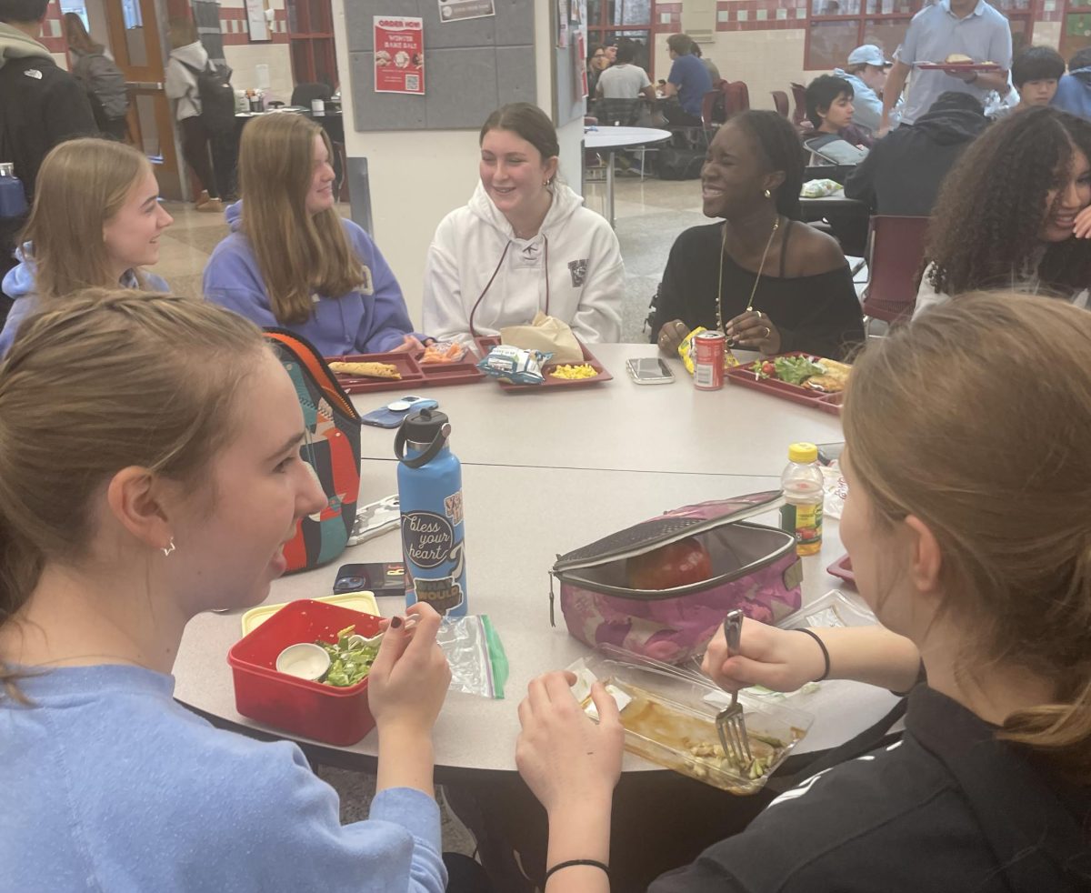 Freshman eating with friends during lunch