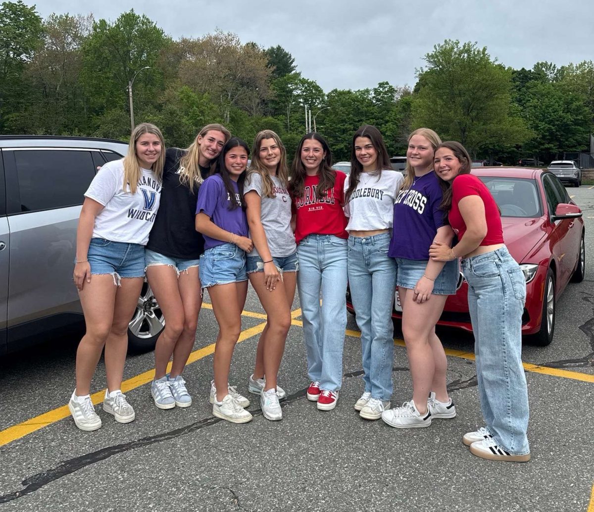 WHS seniors in their school shirts from a range of colleges and universities
