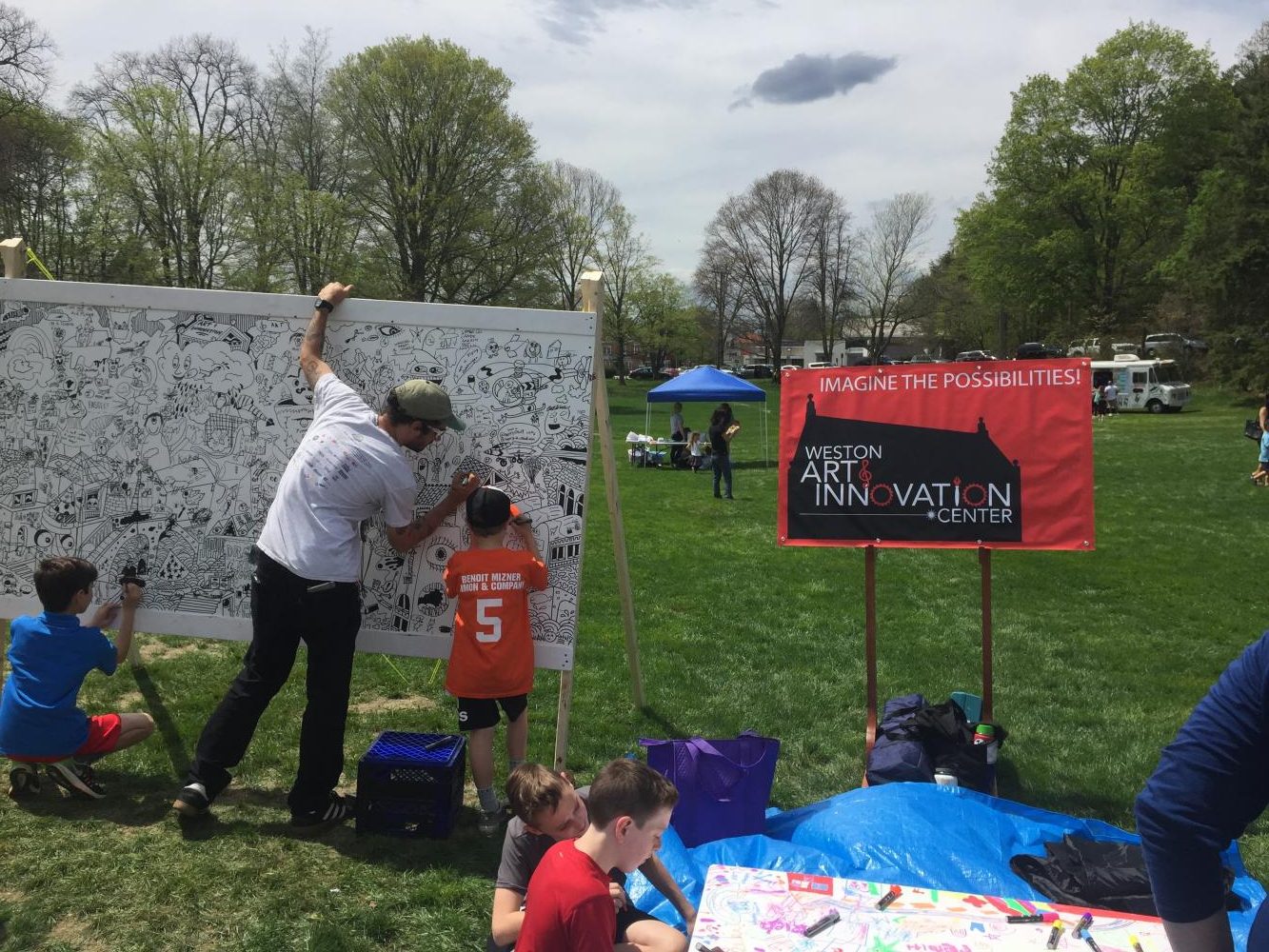 Town residents draw on the Weston Art Innovation Center's drawing board.