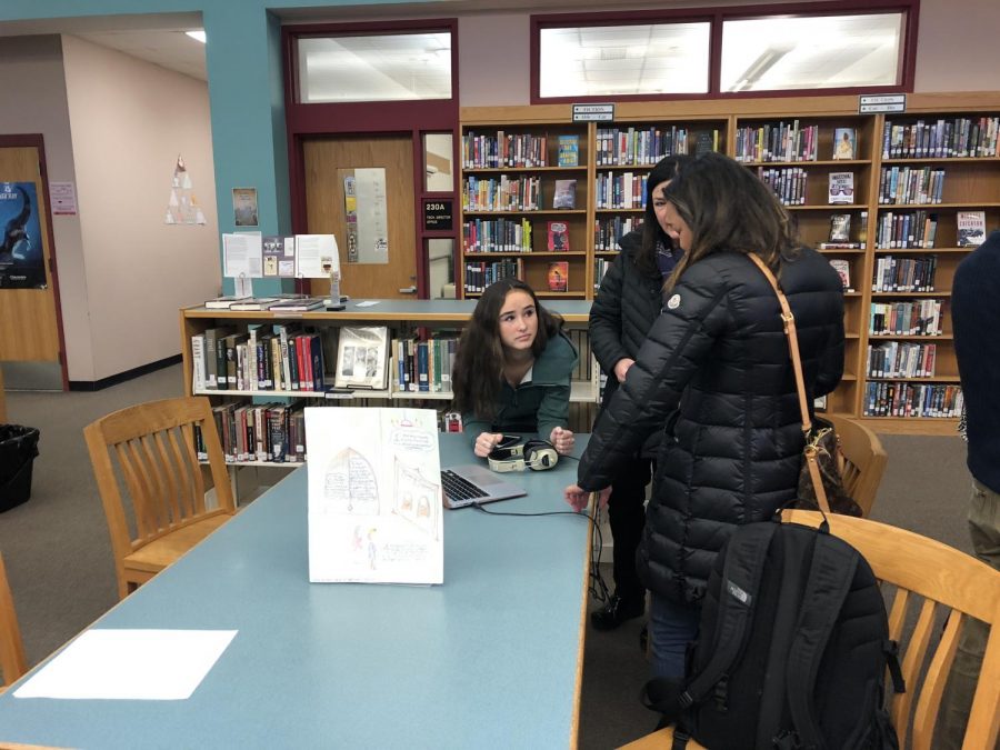 Olivia Swartz presents her video to parents at the event.