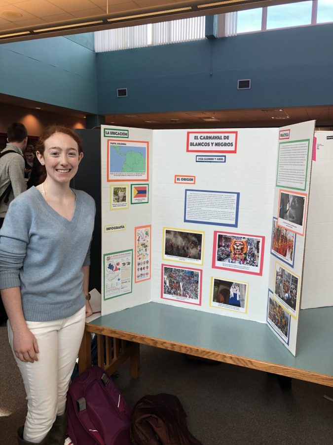 Ariel Silverman smiles as she shares her poster on a famous Columbian Carnaval.