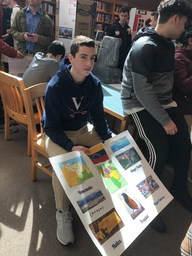 Freshman Miles Backer shares his poster on the country of Venezuela.