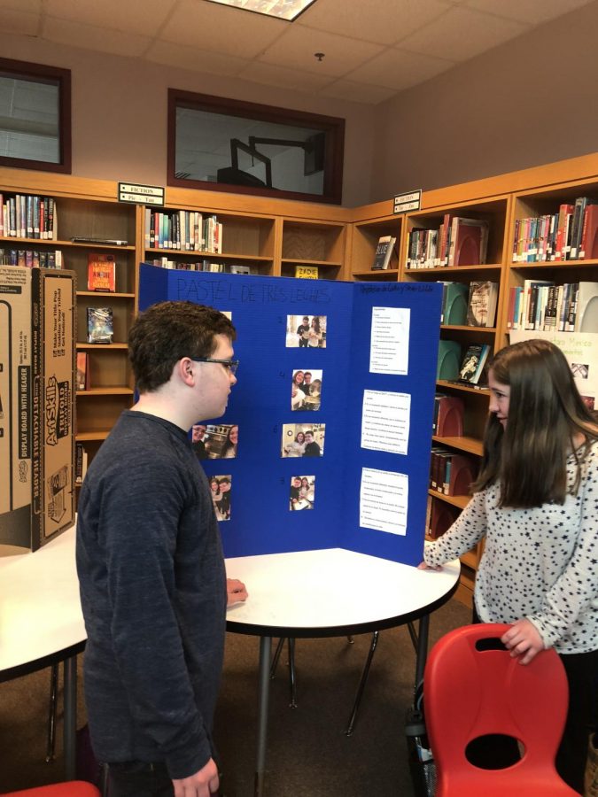 Siblings sophomore Steven  and freshman Caitlin LaValle working together at the fair.