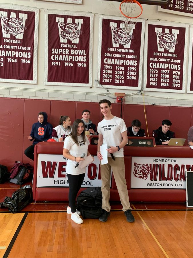 Senior co-emcees Becca Abrams and Ezra Gordon pose for a picture before the senior assembly.