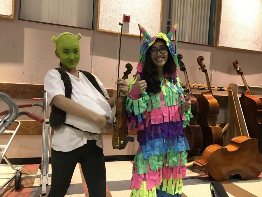 Left to right: Juniors Michelle Kim as Shrek and Kimya Jalinous as a piñata.