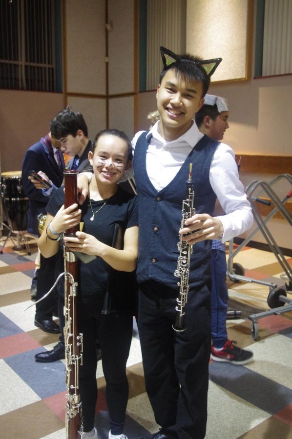 Freshman bassoonist Olivia Chen and senior oboist Aidan Chen dress as cats. 
