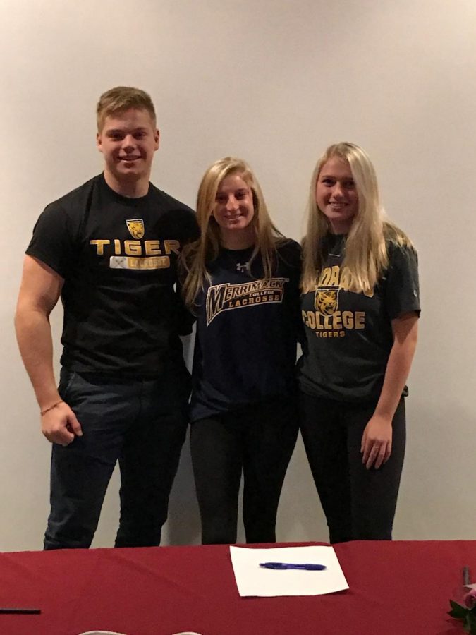Hayden Zeller, Krissy Kakridas, and Amanda Lake wear gear from the colleges they committed to for lacrosse.