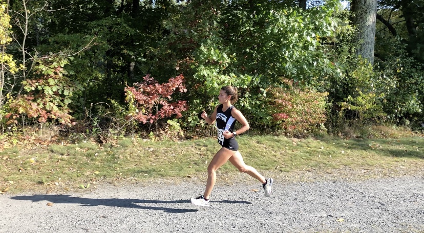 Senior and captain Phoebe Pohl competes in cross-country race. 