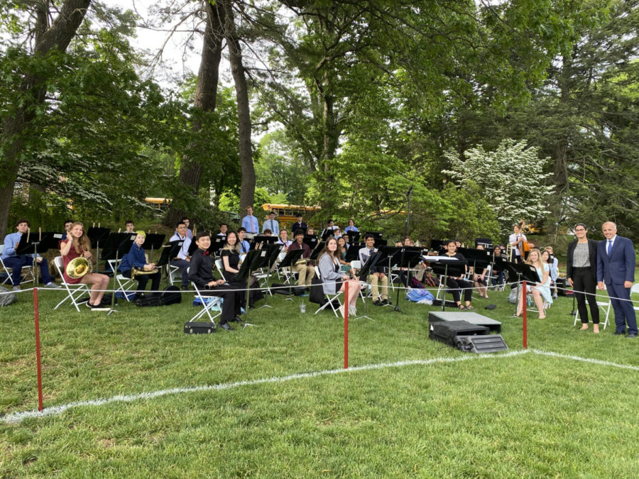 HS Band members set up before the 2021 graduation ceremony.