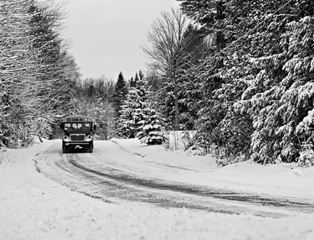 School bus trekking through the snow