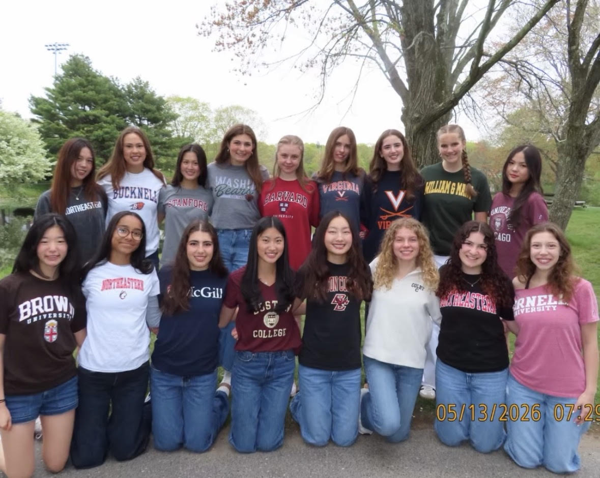 Seniors on commitment day wearing their college decision shirts