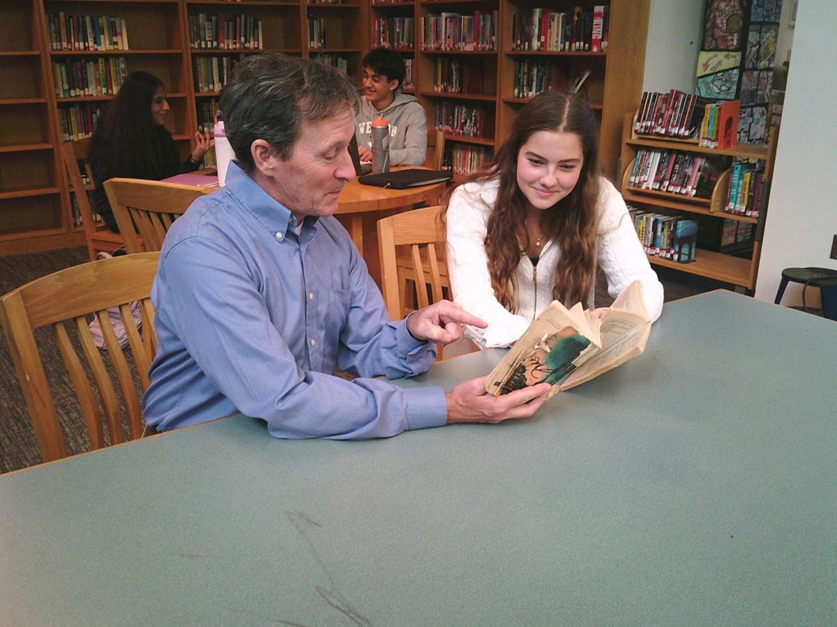 Kelley meets with student to discuss  "Macbeth"
